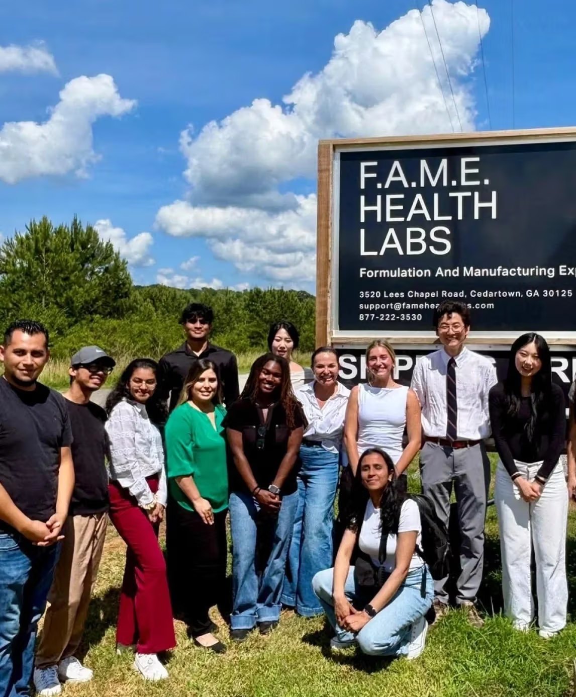 A Cedars Rising cohort outside the F.A.M.E. Health Labs sign in Cedartown, Georgia