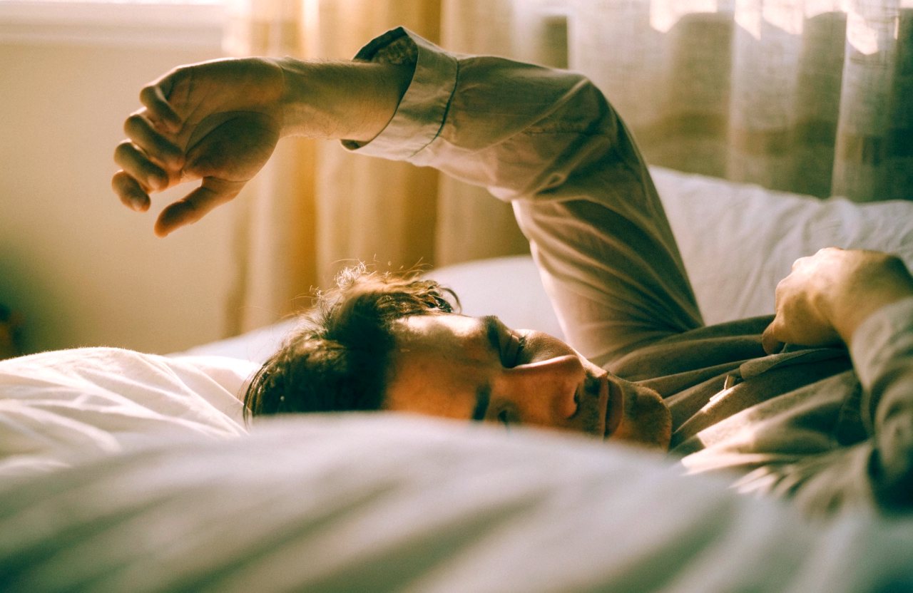 A man waking rested in morning light